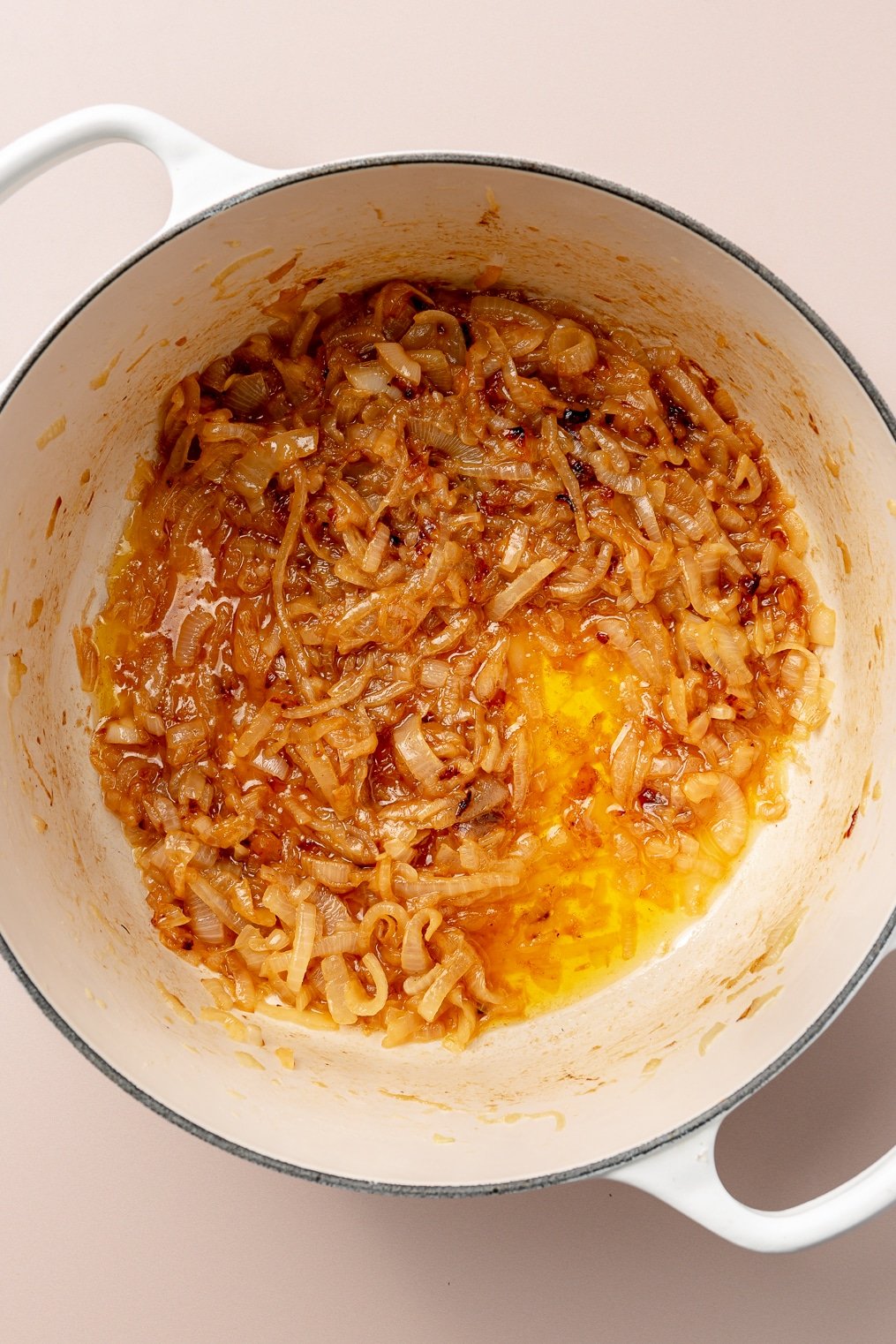 Caramelized onions in a large enameled cast iron pot.