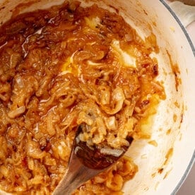 Caramelized onions in a large enameled cast iron pot.