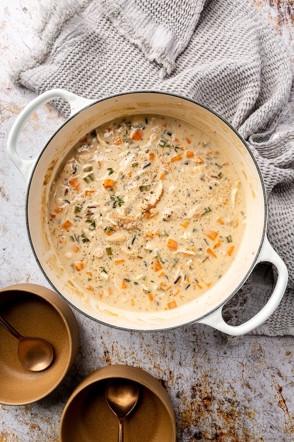 Creamy chicken wild rice soup in a large enameled cast iron pot.