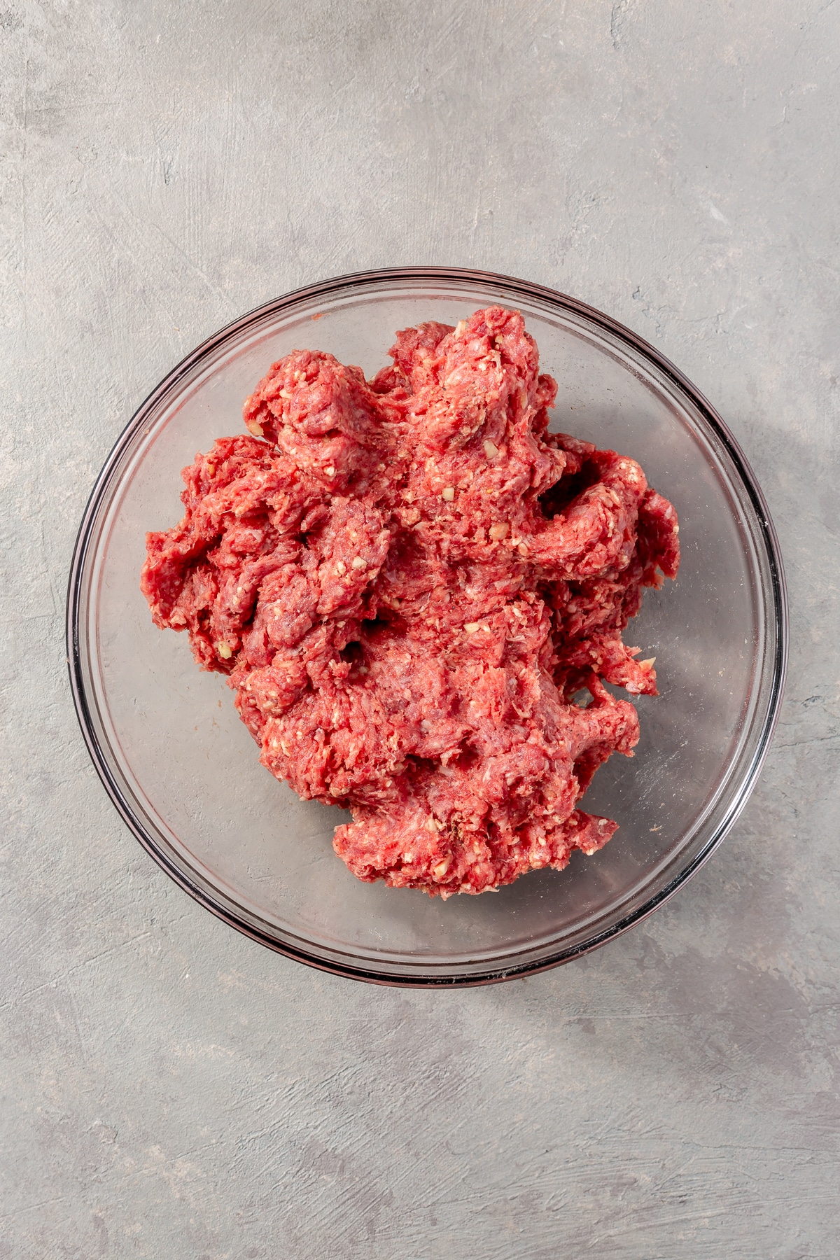 A variety of ingredients have been mixed into the ground beef.
