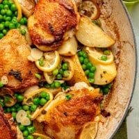 Fully prepare chicken vesuvio sits in a white enameled pot.