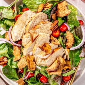 A large serving bowl of copycat Panera fuji apple salad.