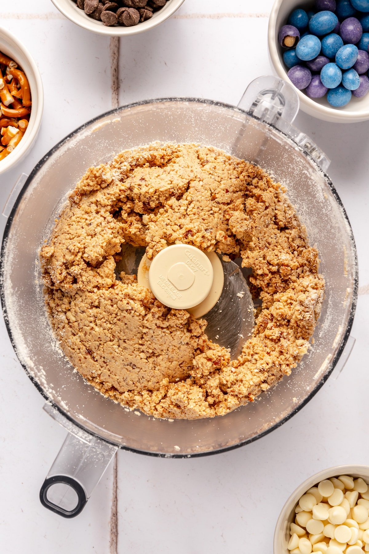 The base of kitchen sink energy balls in a food processor.