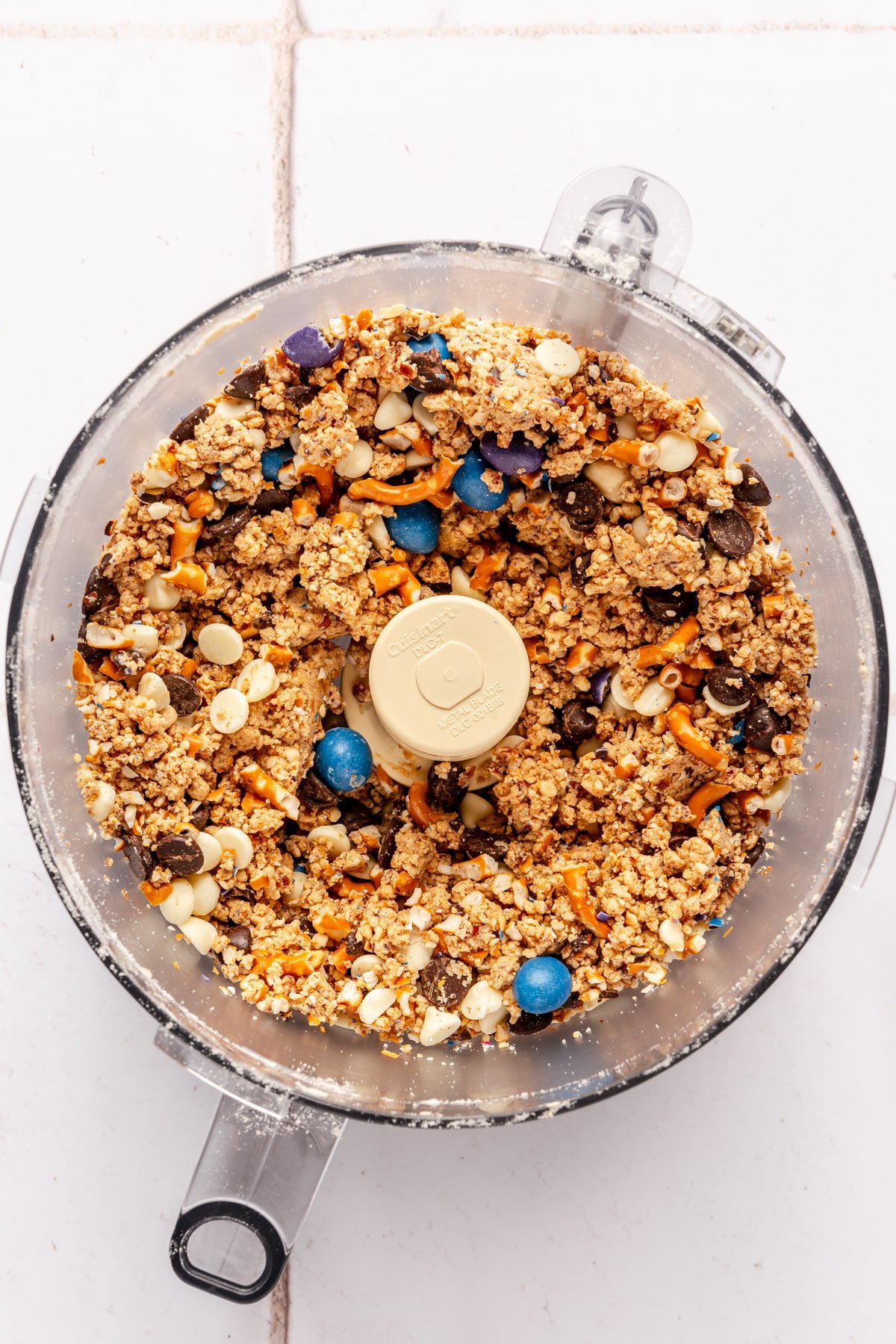Kitchen sink protein ball ingredients in a food processor.