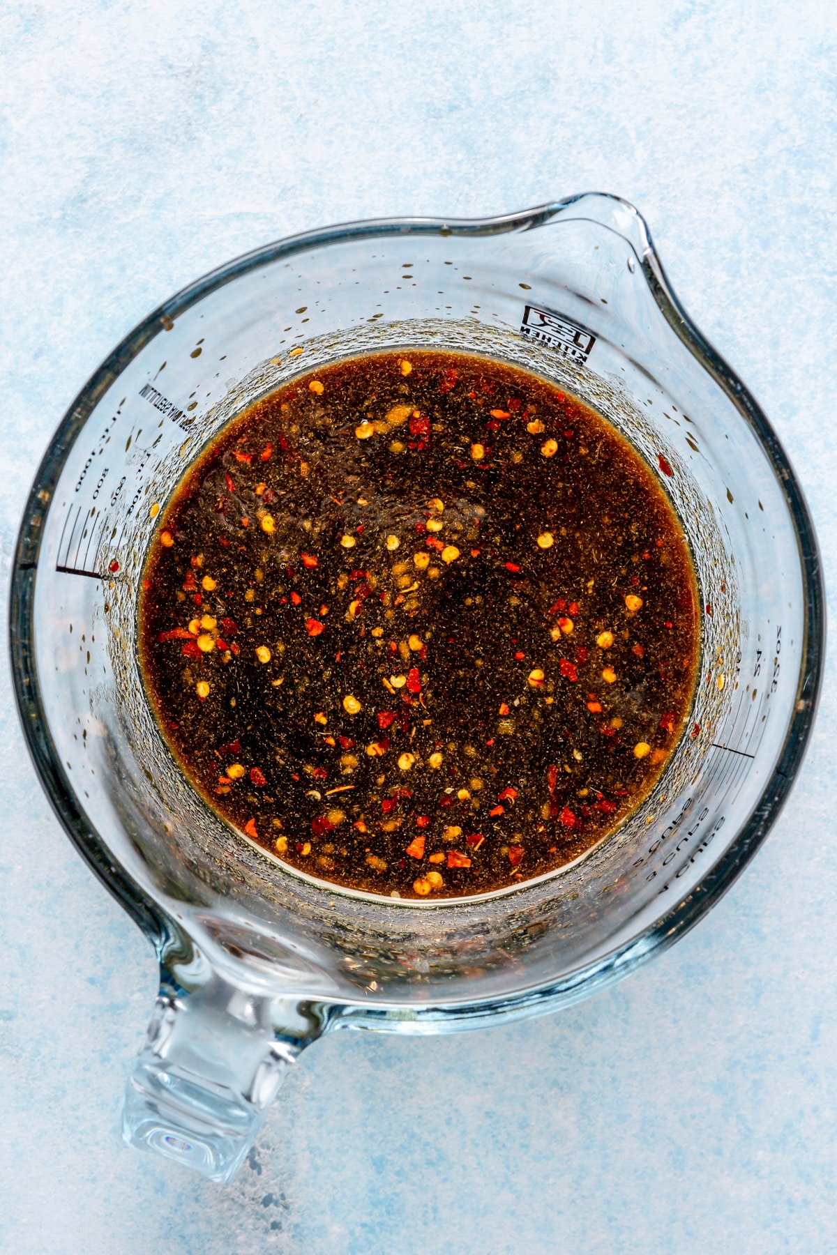 A Korean-inspired sauce in a measuring cup.