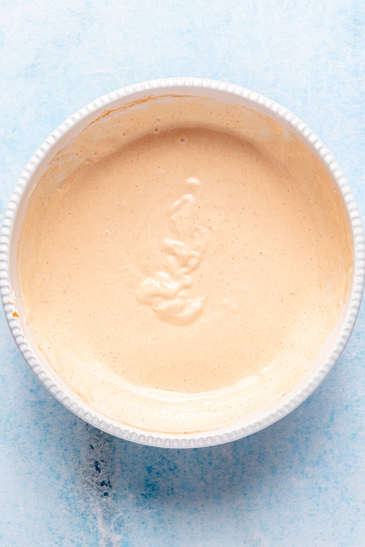 A bowl of homemade sriracha mayonnaise.