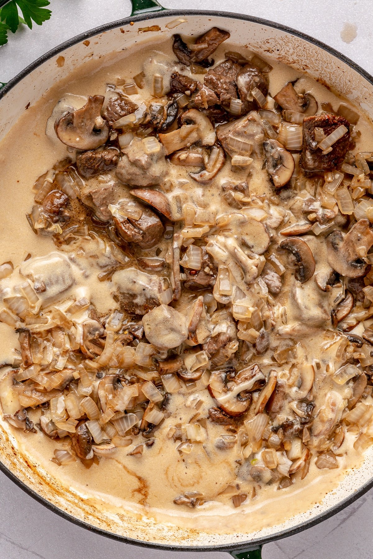 The mushroom and onion mixture for beef stroganoff stirred in to beef stroganoff gravy.