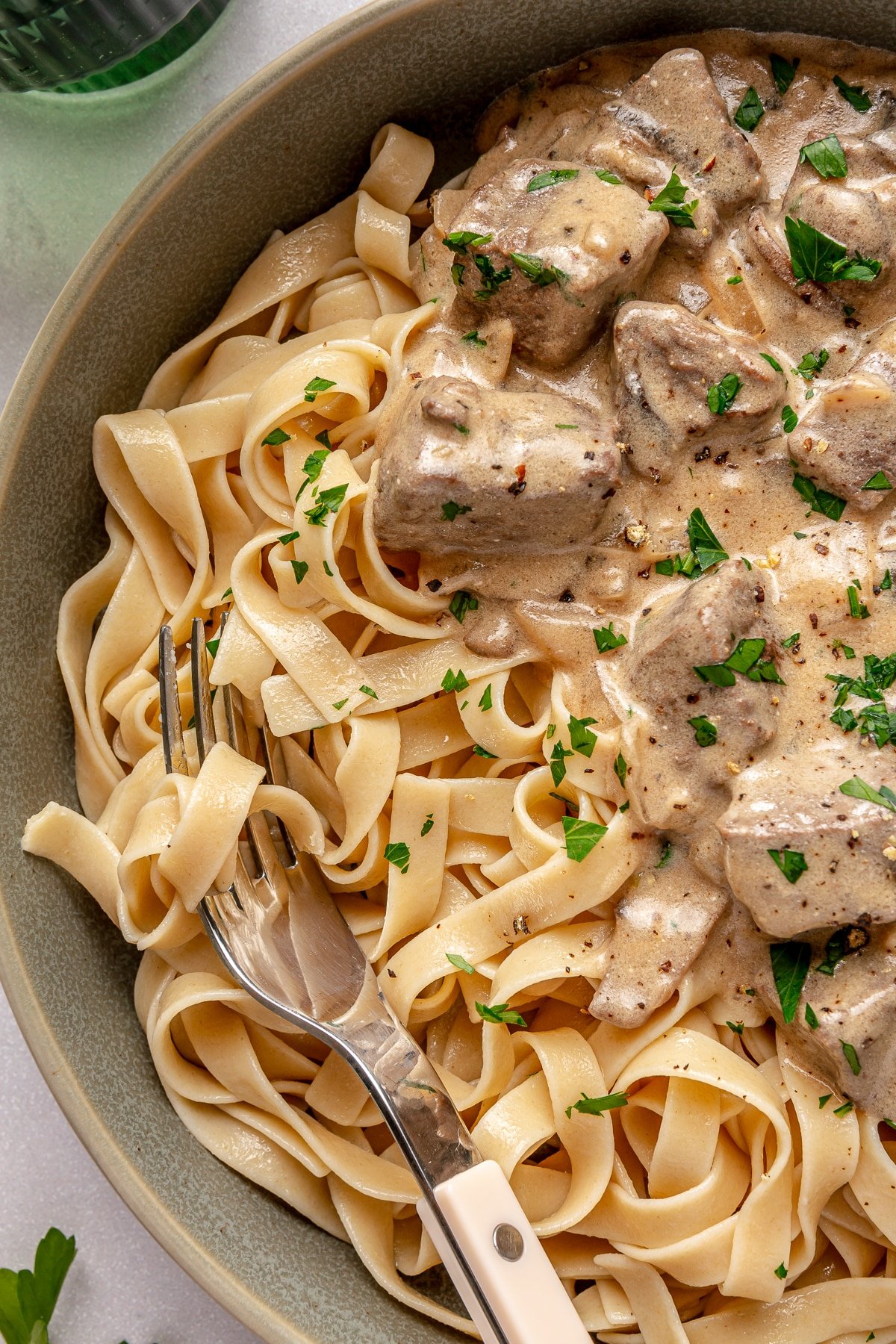 Close up of gluten free beef stroganoff on a plate.