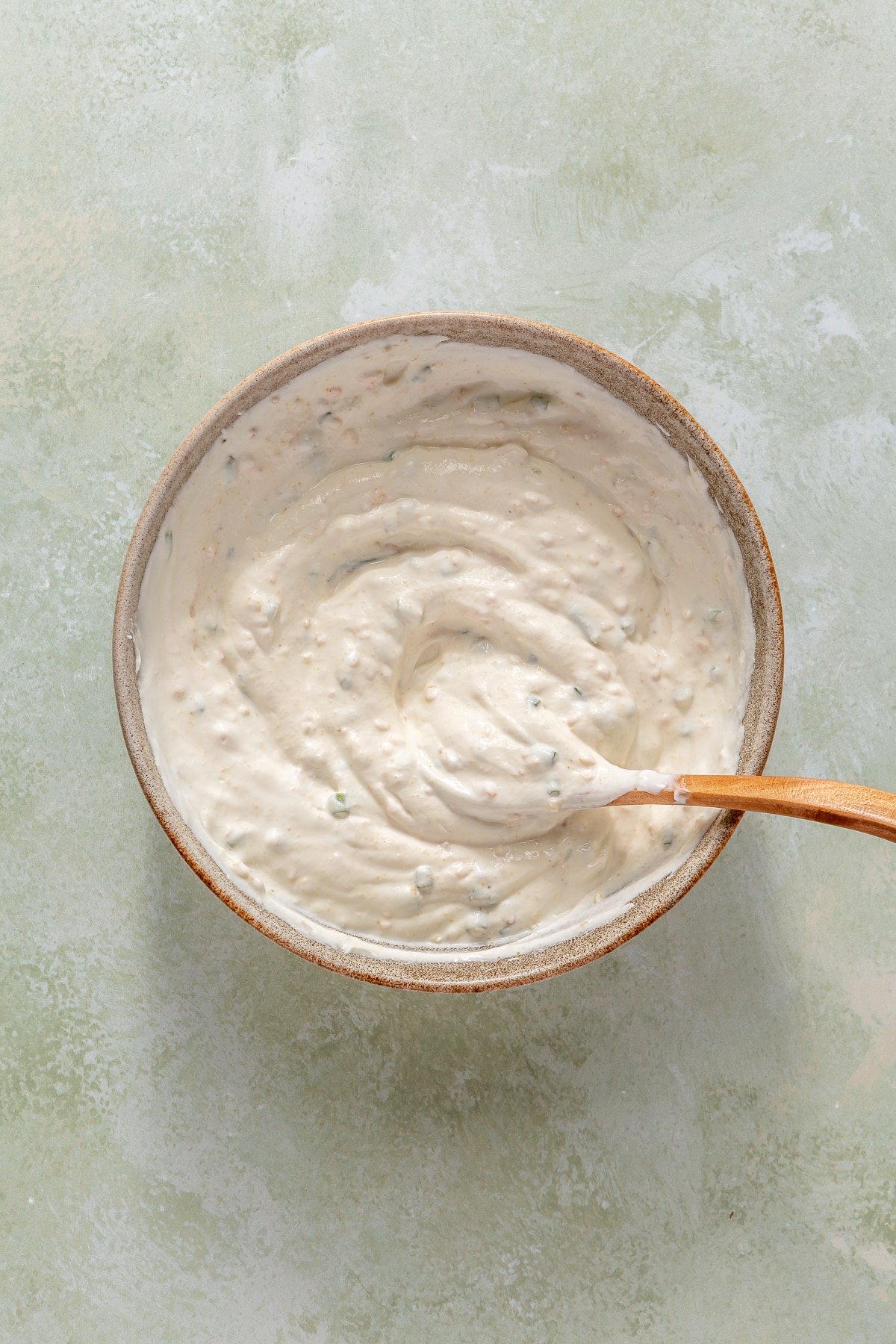 Fresh, homemade French onion dip stirred together completely.