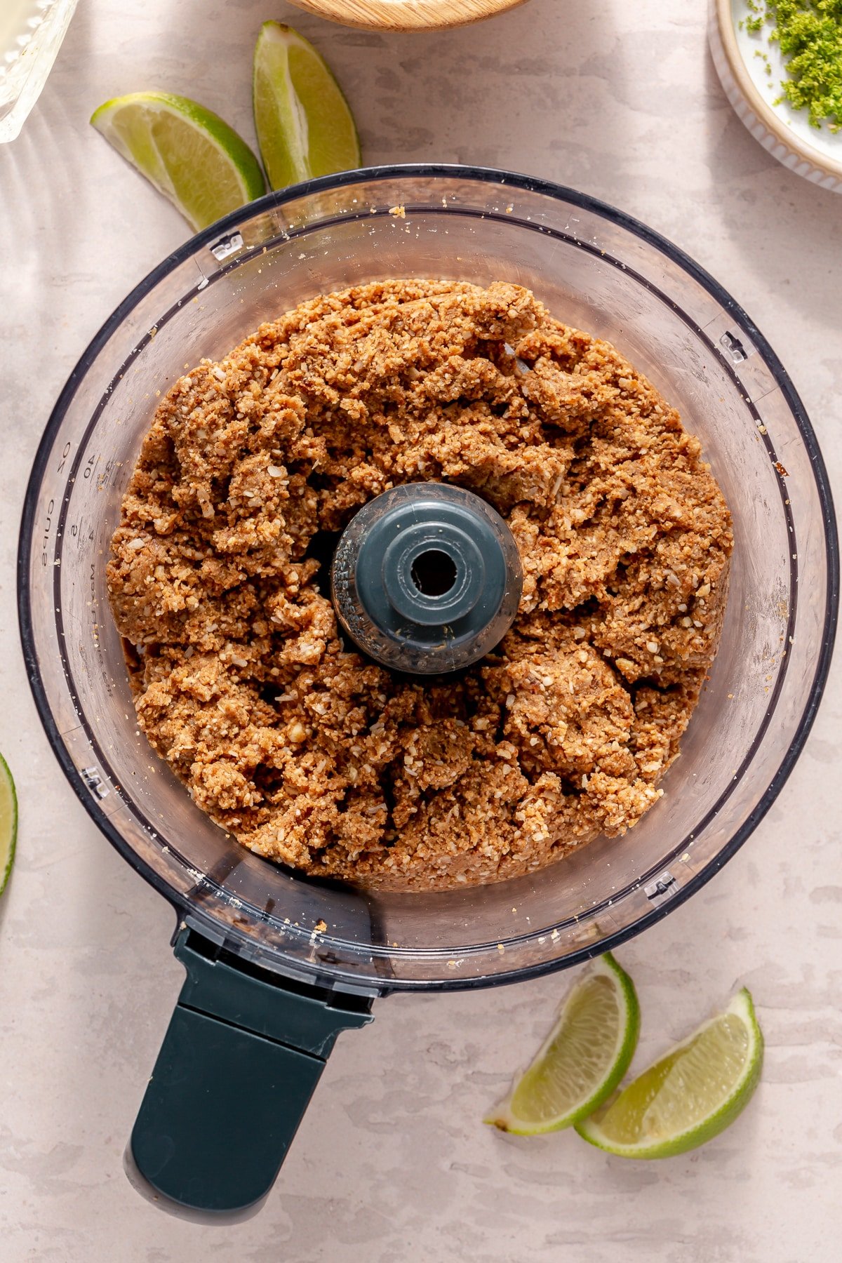 The ingredients for Key Lime Pie energy balls in a food processor.