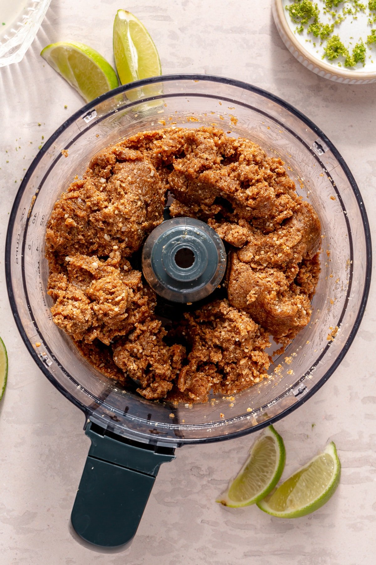 The ingredients for Key Lime Pie energy balls in a food processor.