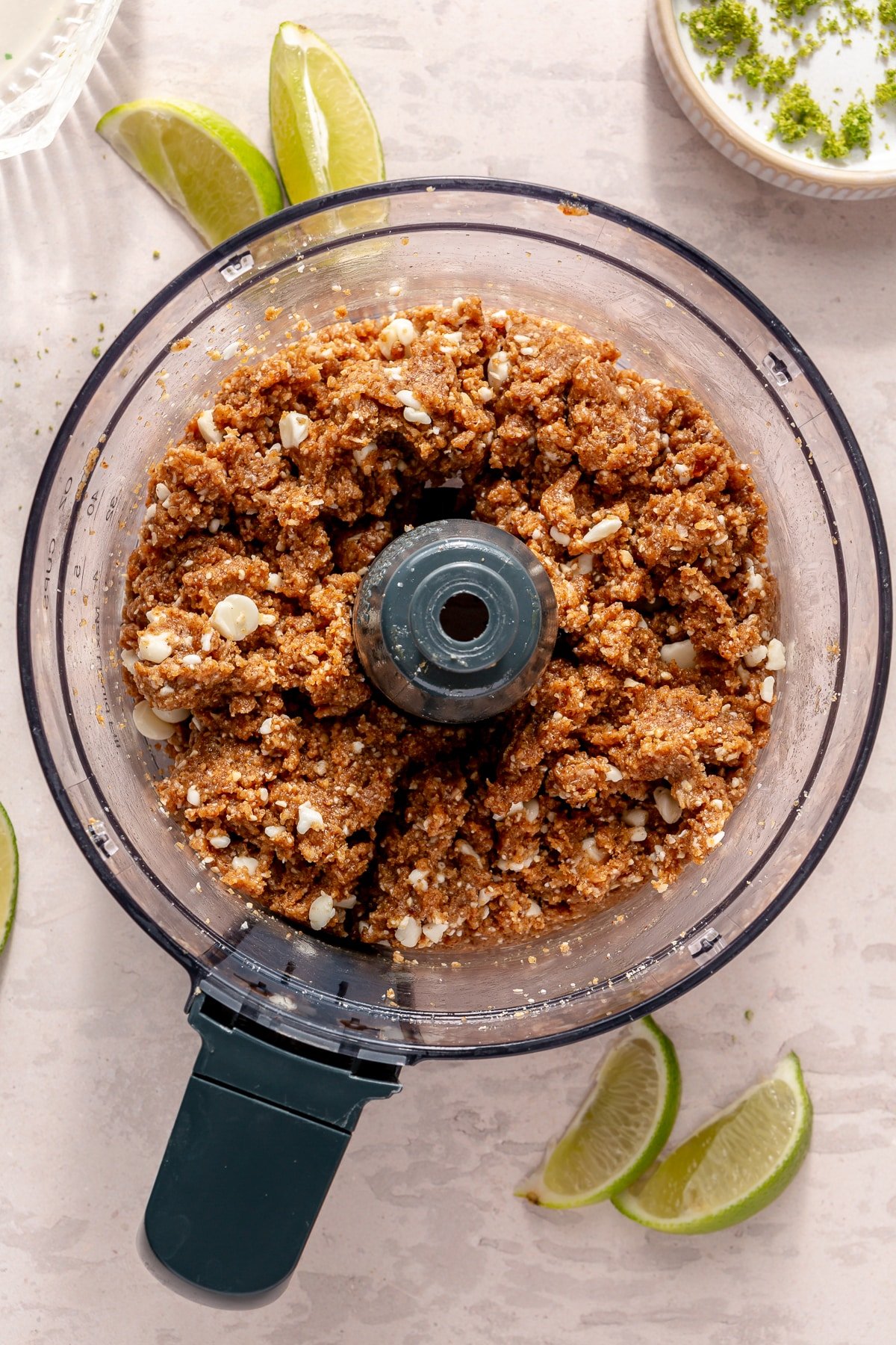 The ingredients for Key Lime Pie energy balls in a food processor.