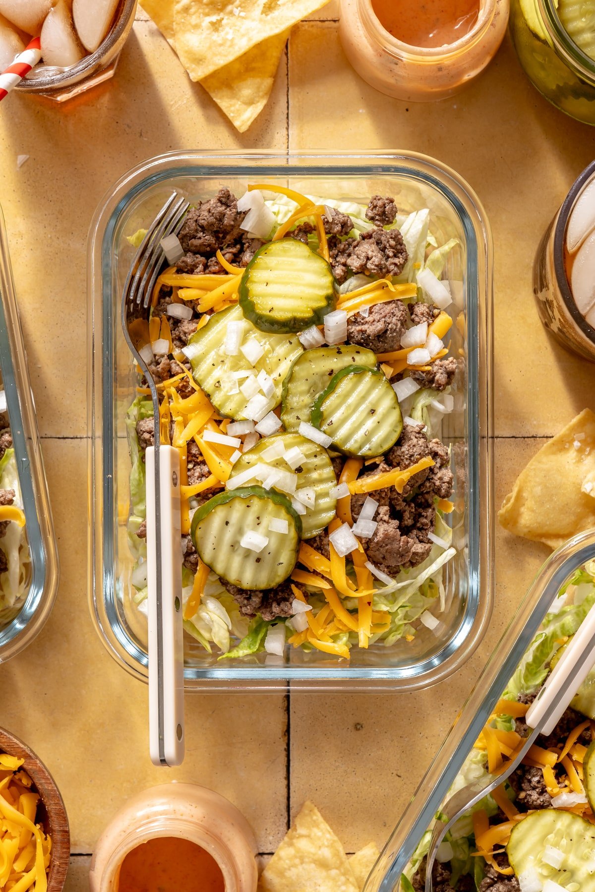 A clear meal prep container filled with Big Mac Salad.