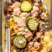 A clear meal prep container filled with Big Mac Salad.