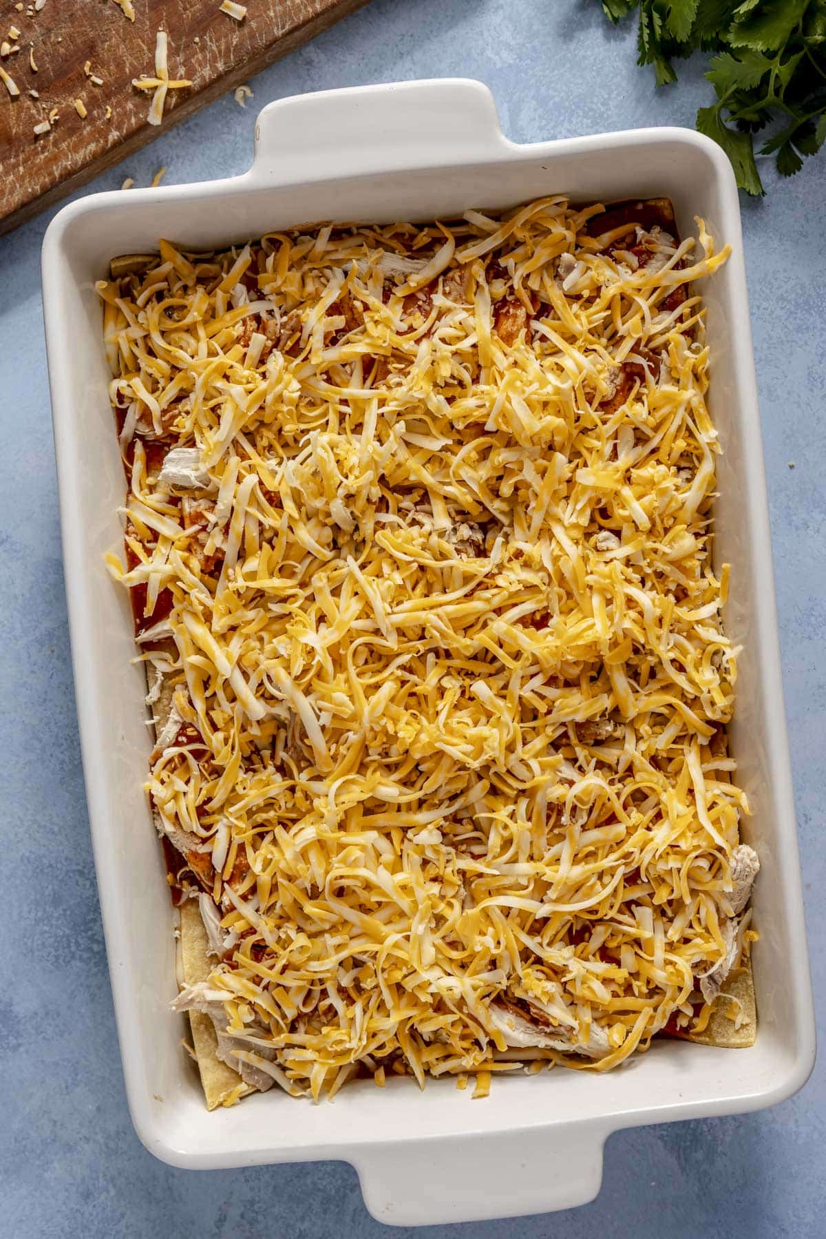 A chicken enchilada casserole before going into the oven.