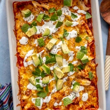 A 9x13-inch casserole dish of chicken enchilada casserole.