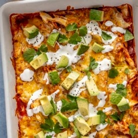 A 9x13-inch casserole dish of chicken enchilada casserole.