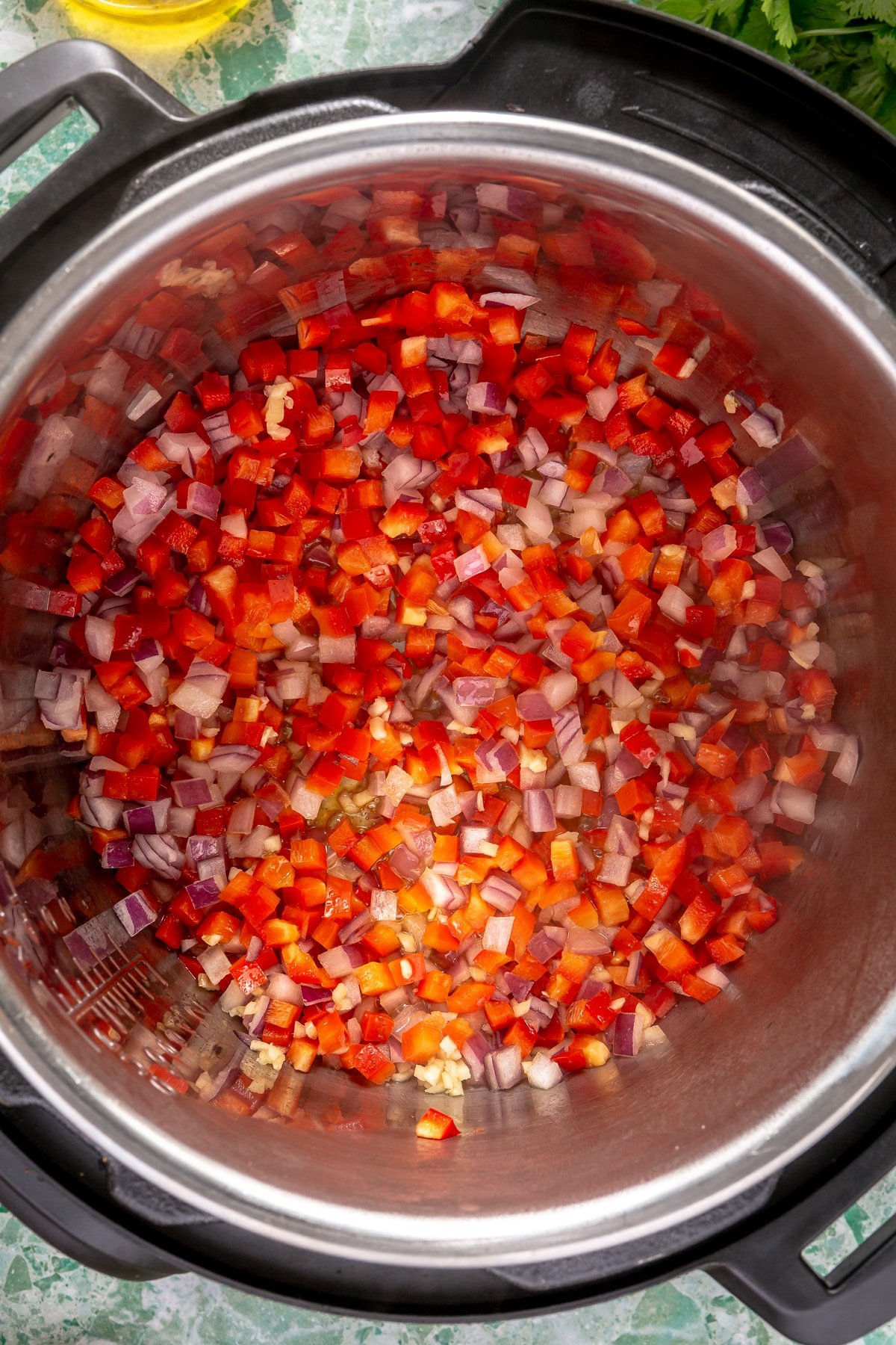 Peppers and onions sauteed in an Instant Pot.