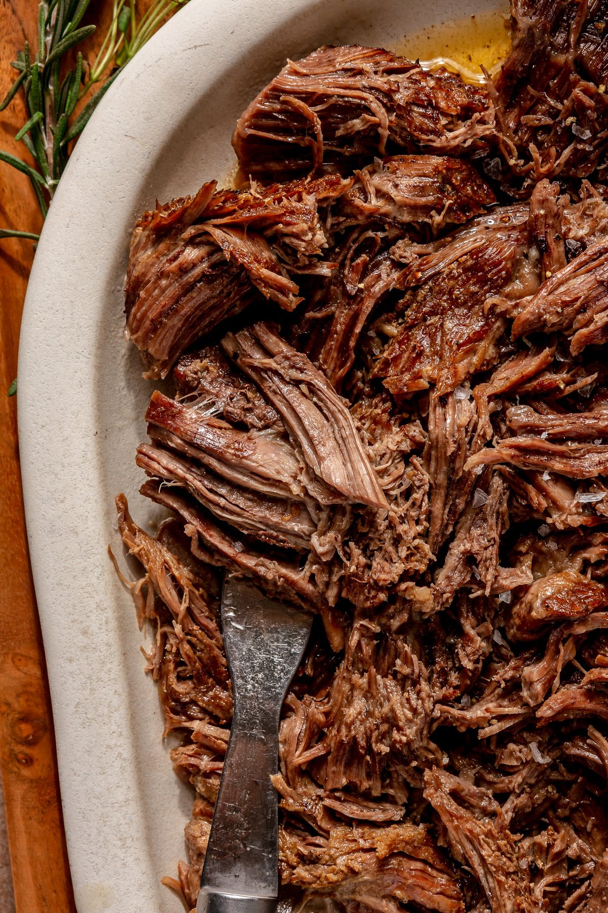 Shredded Instant Pot pot roast on a platter.