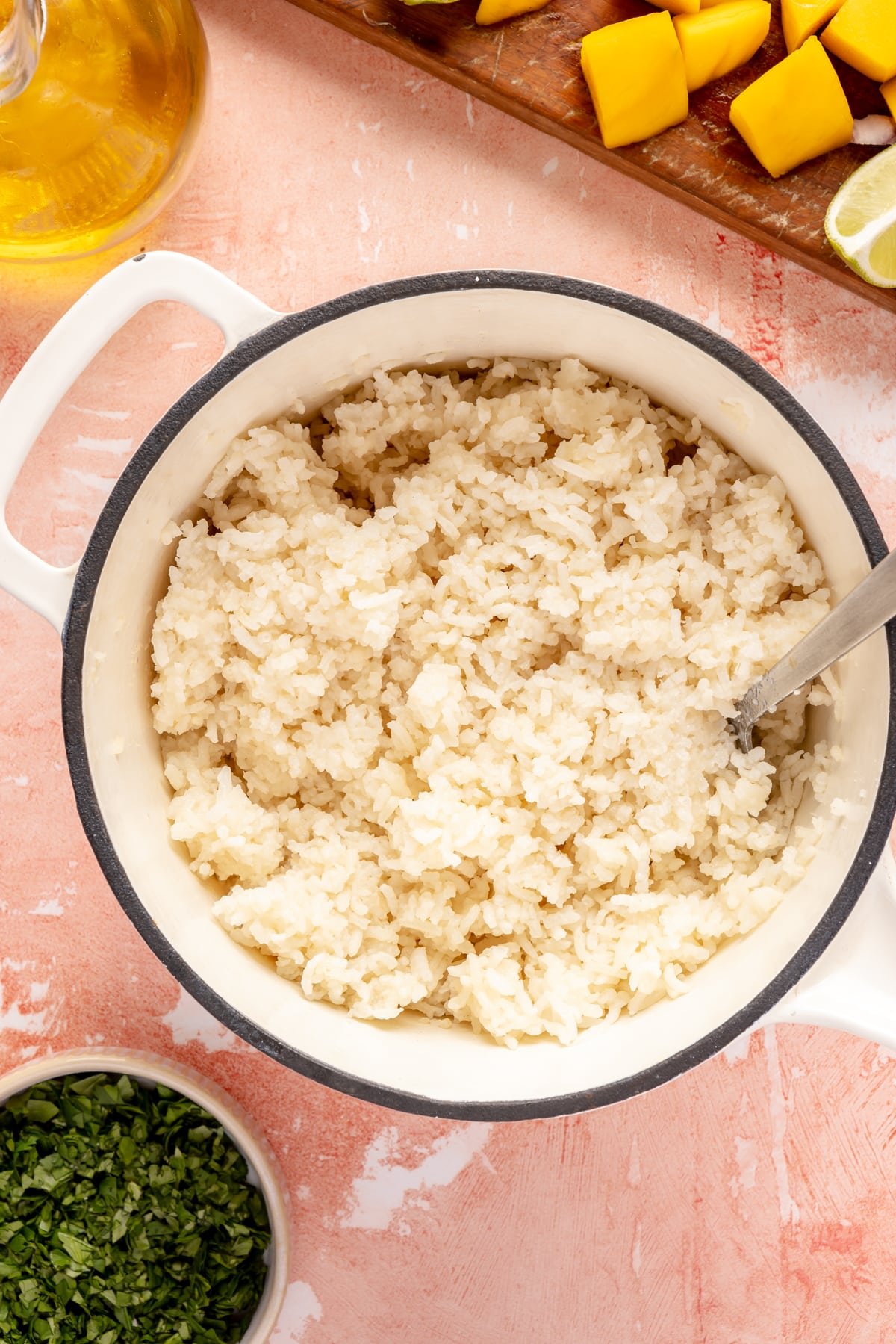 Cooked white rice in a small white pot. 