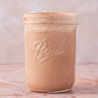A mason jar of peppermint mocha coffee creamer.