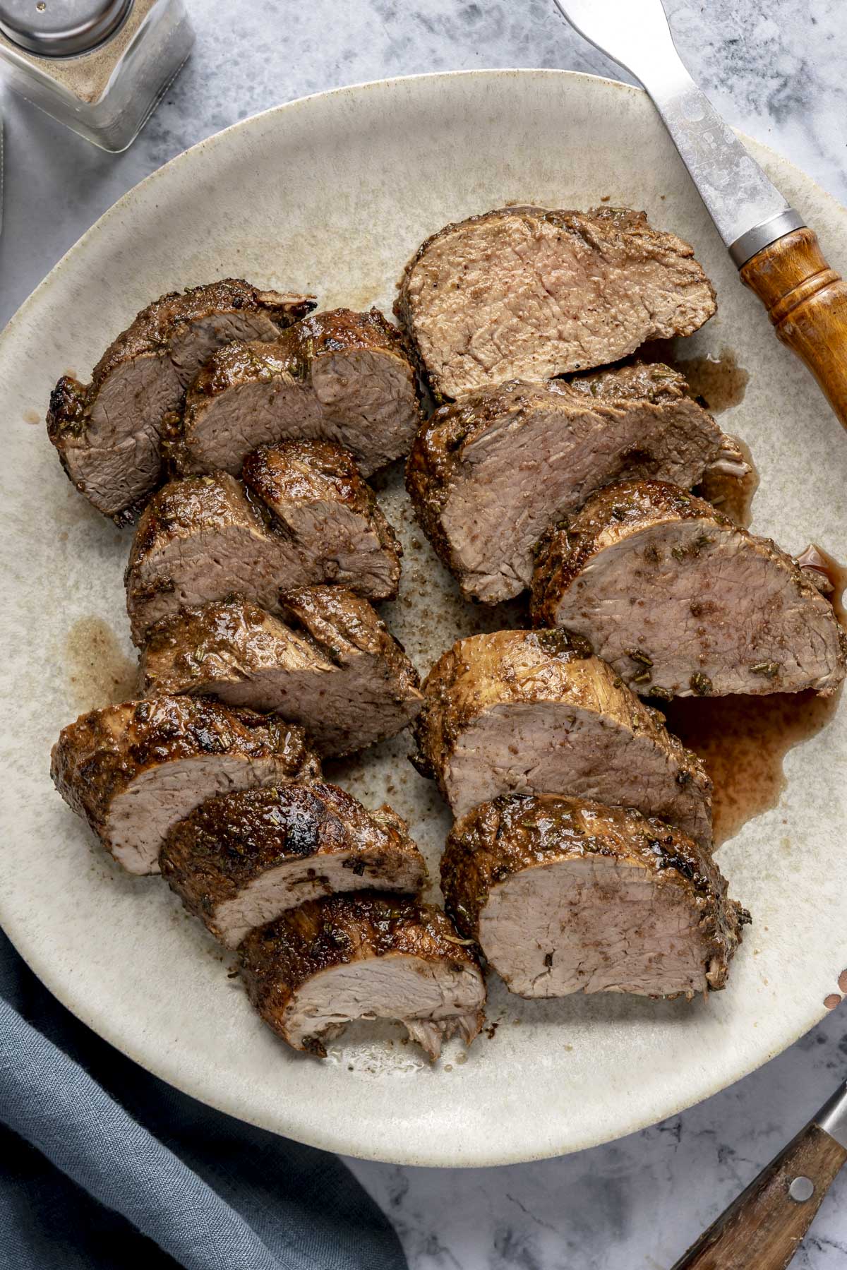 A platter of sliced pork tenderloin.