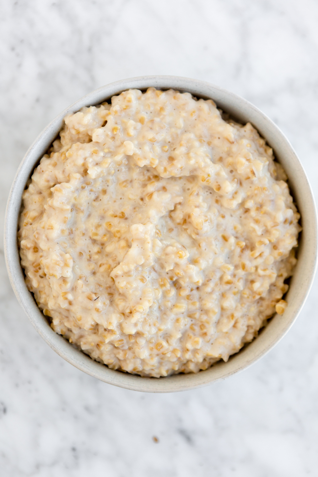 Top down view of bowl with creamy steel cut oats.