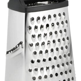 Metal, boxed cheese grater on a white background.