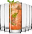 Triangle of glasses with front glass filled with mint leaves, coral colored liquid, and ice.