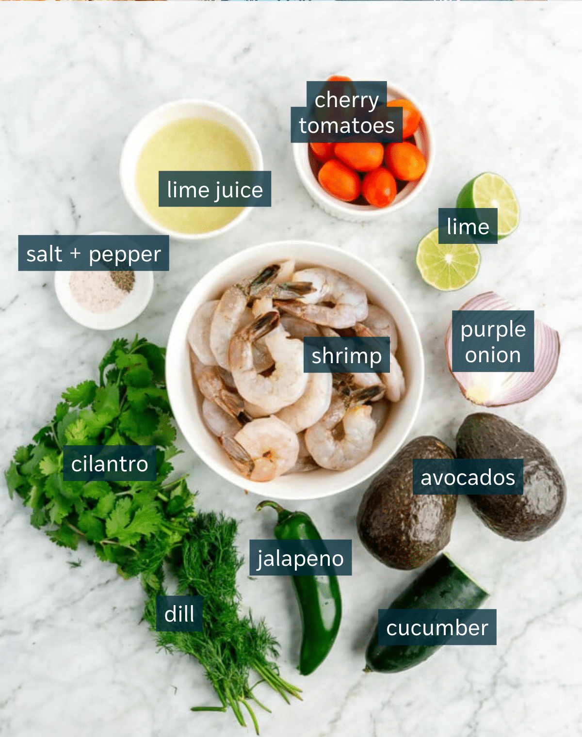 Ingredients for easy shrimp ceviche with avocado sit on a marble countertop.